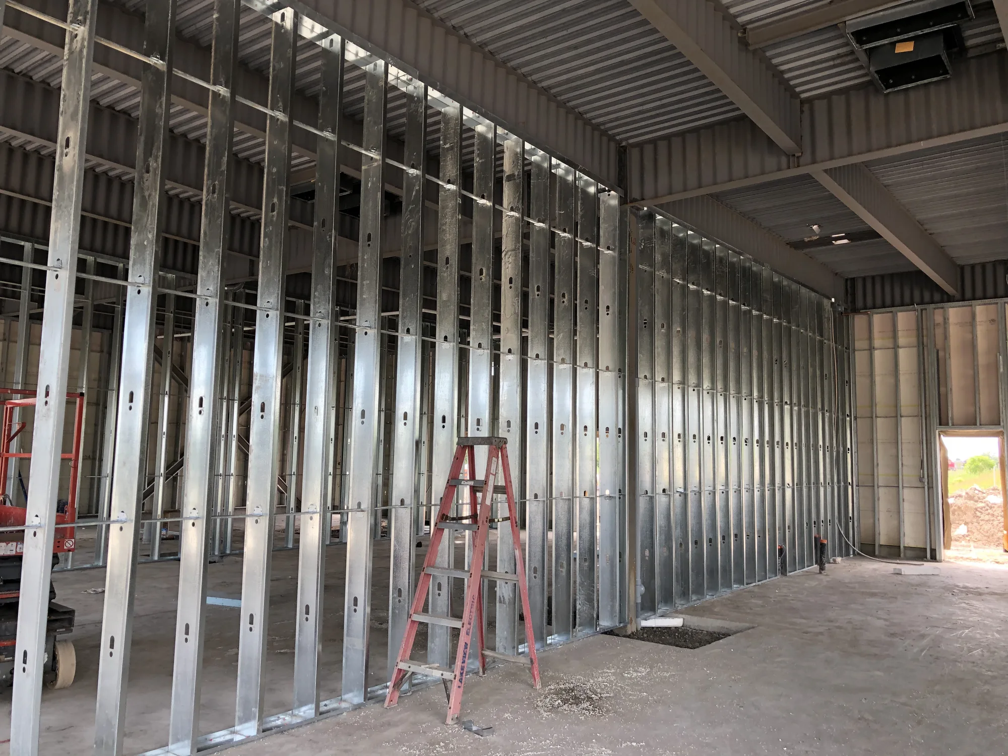 Row of steel stud walls framed in a commercial unit