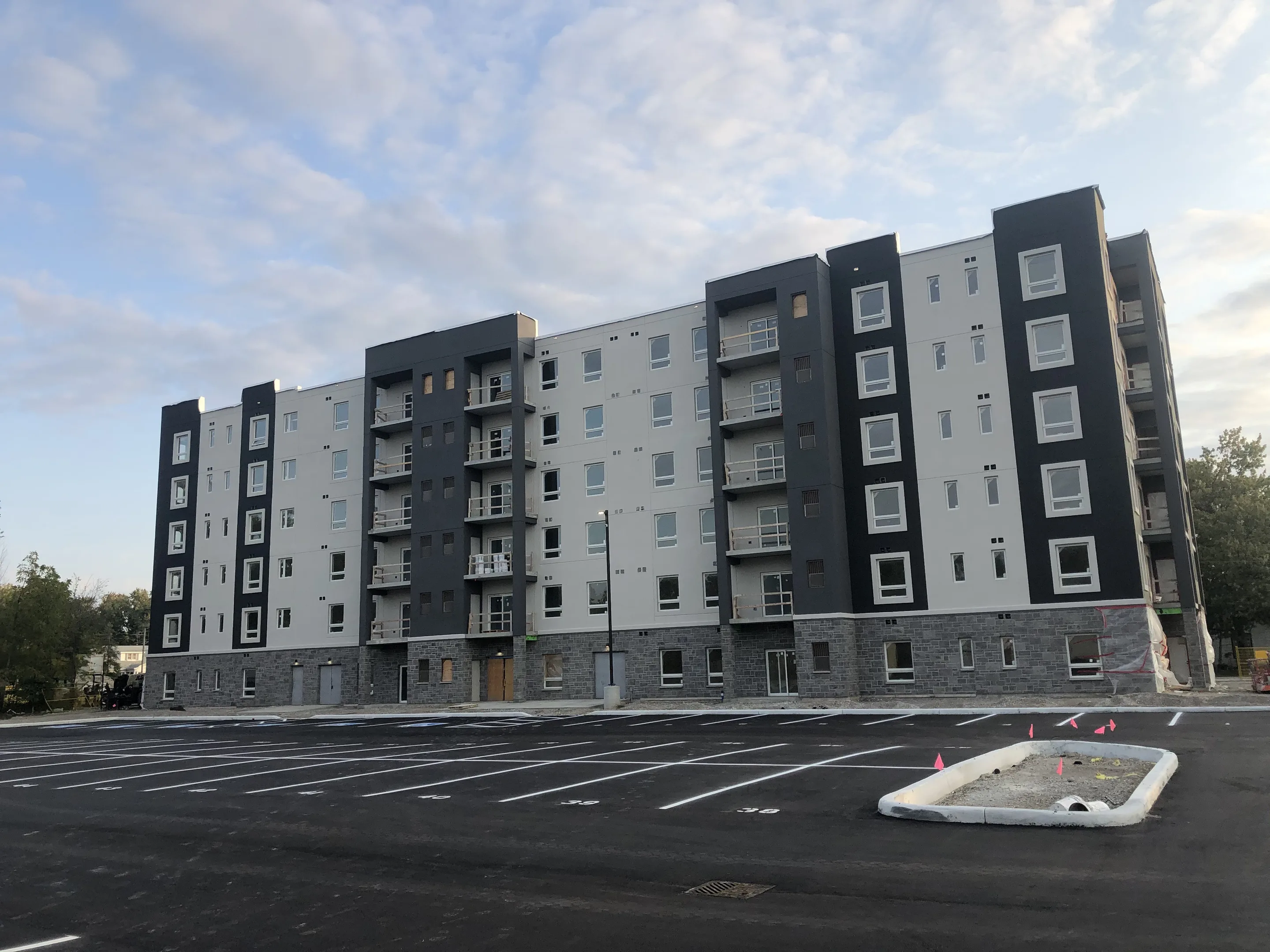 Completed mid-rise apartment building with a finished exterior