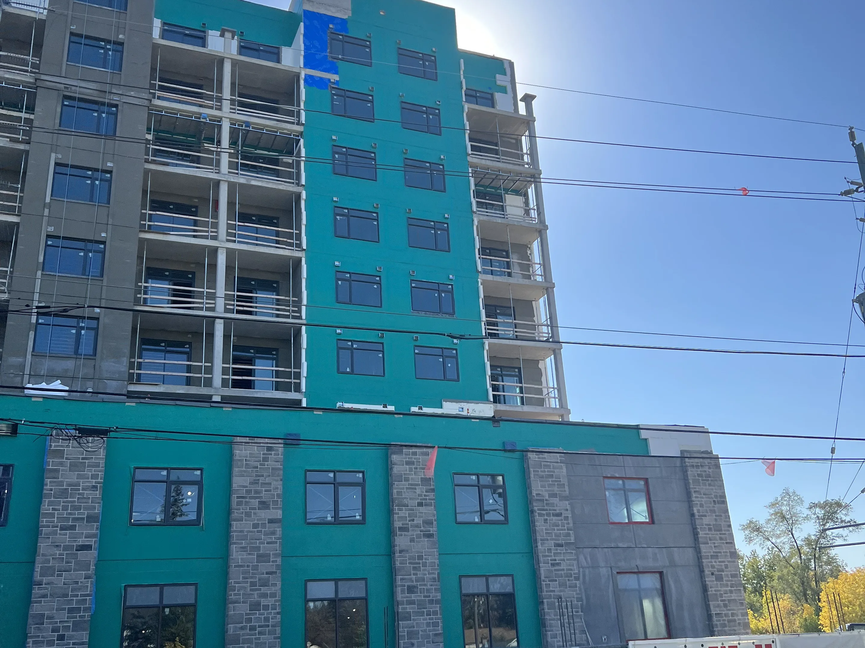 Completed high-rise residential tower with a finished exterior